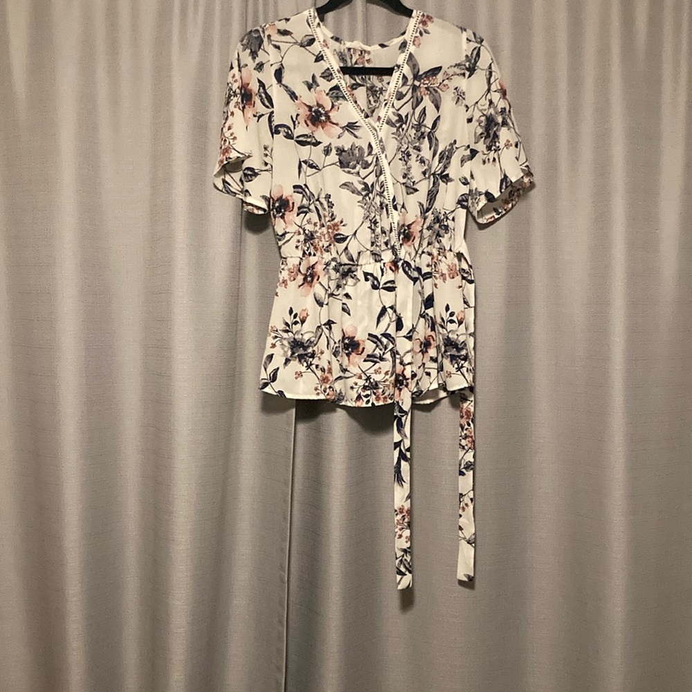 White blouse with flowers from Sienna Sky in size medium.
